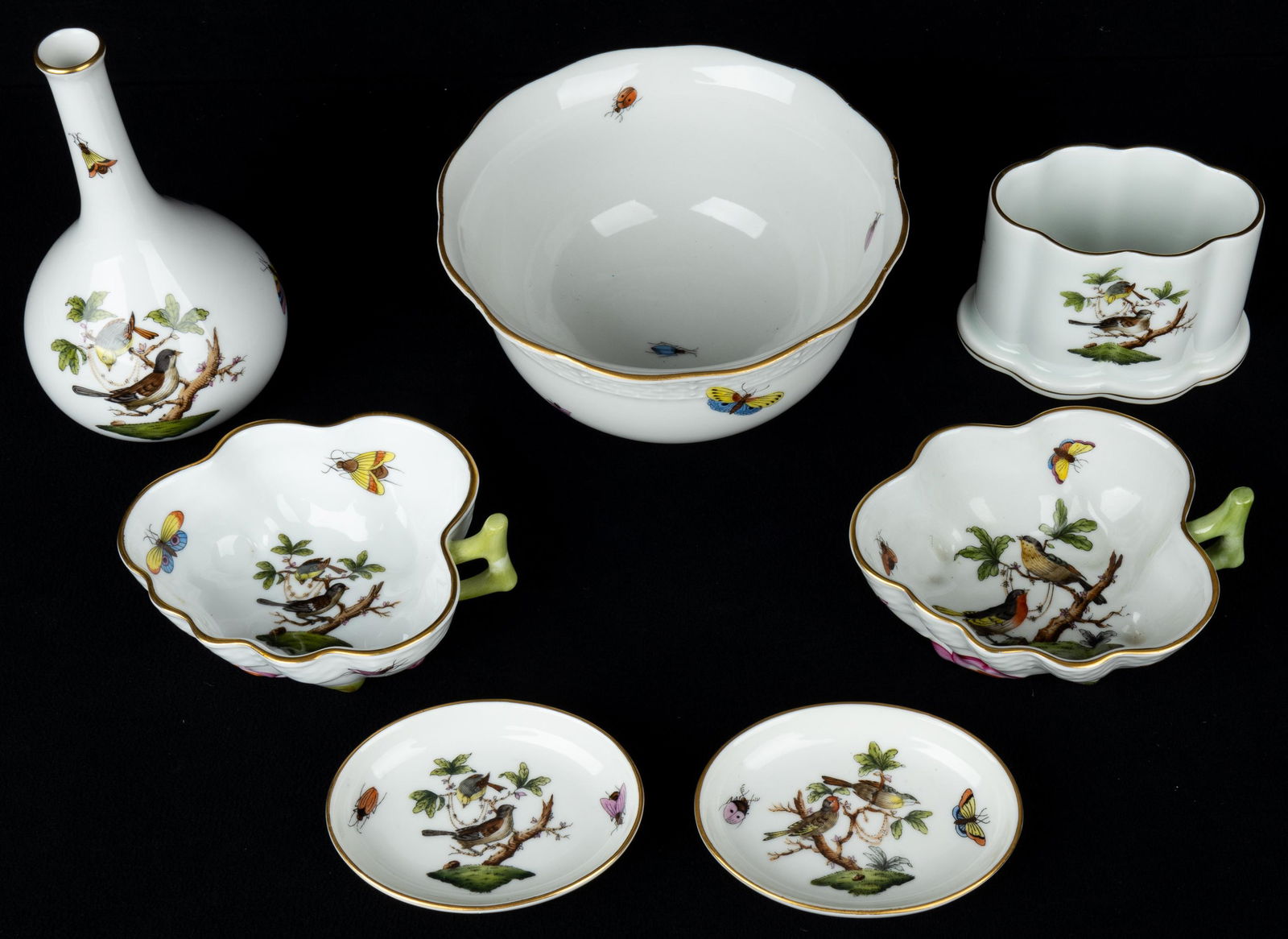 Herend Porcelain: 8 pieces of Herend porcelain, including cigarette holder, toothpick holder, 4 shallow bowls, bowl approx 5", and a bud vase approx 5"H.