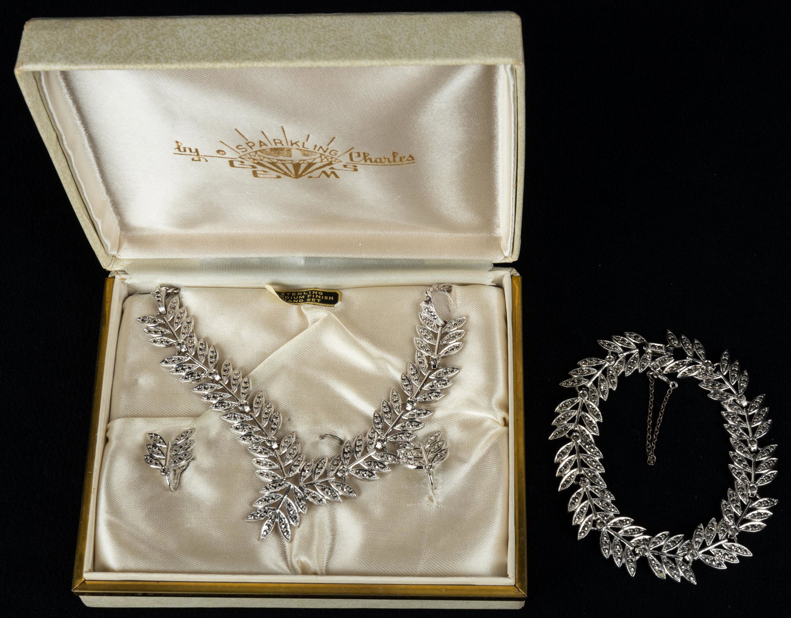 Vintage Sterling Marcasite Jewelry Suite: Sterling silver marcasite fern detail jewelry suite with original "Sparkling by Charles" box.
