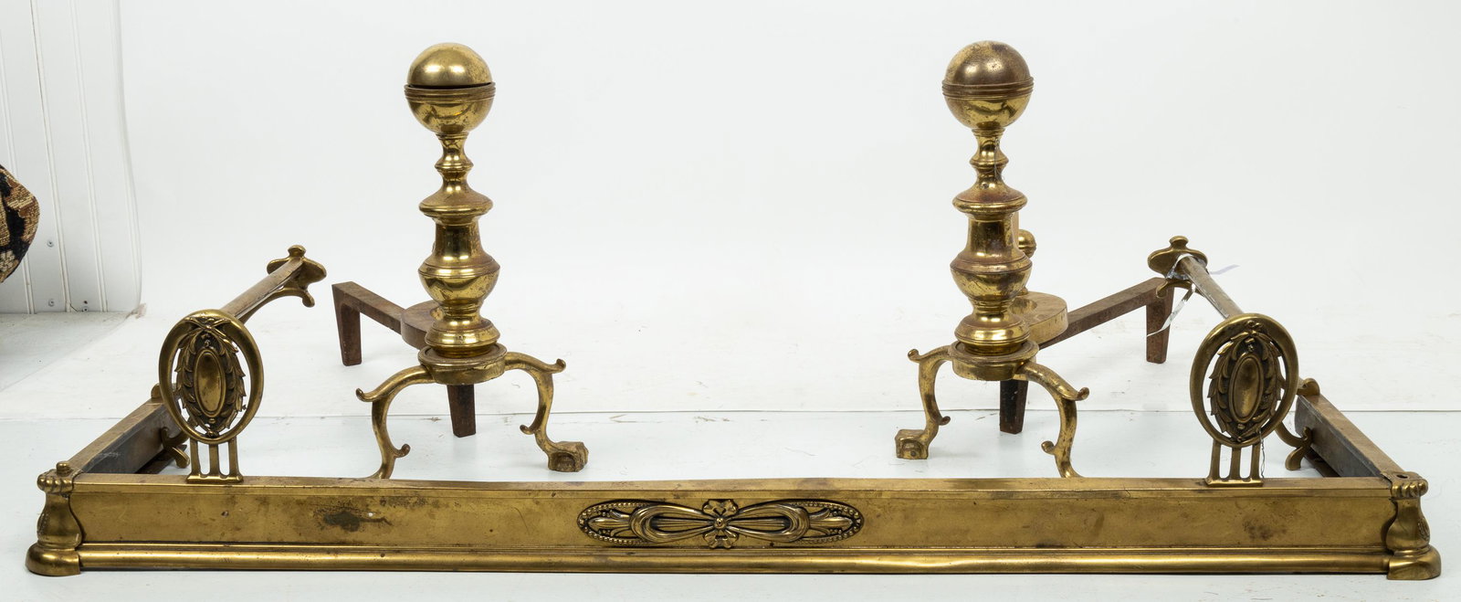 Brass Andirons & Skirt: Brass cannonball style Harvin Baltimore company andirons, and brass fireplace skirt, skirt approx 48"W x 14"D, andirons approx 17"H.