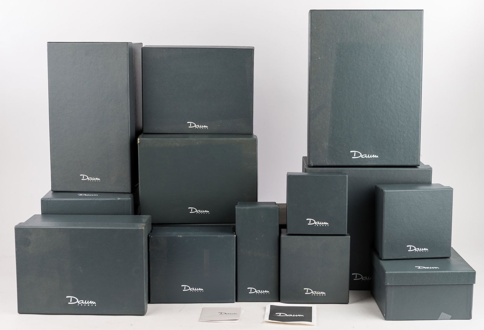 Daum Brand Boxes: Includes 15 Daum France boxes, assorted sizes, with foam inserts, some paper inserts.