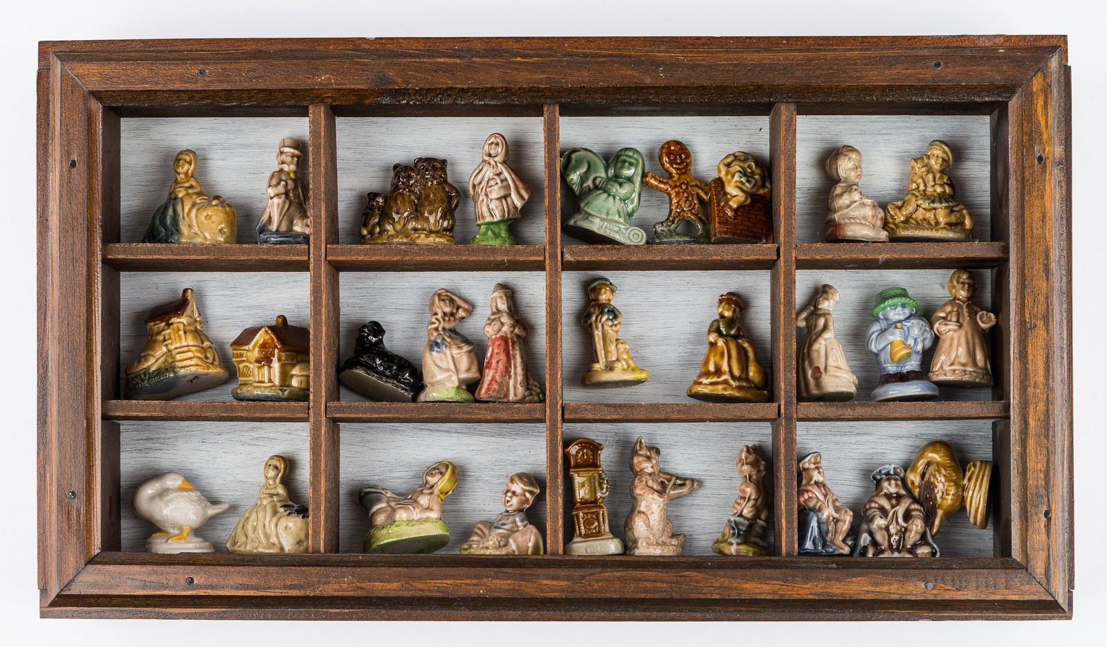 Rare Fairy Tale Wade Figurines (29): There are 29 rare fairy tale Wade figurines in a wooden display box. Some of the figurines included are gingerbread man, Humpty Dumpty, Joan of Arc, Old Lady in The Shoe, Cat and the Fiddle, Little Re