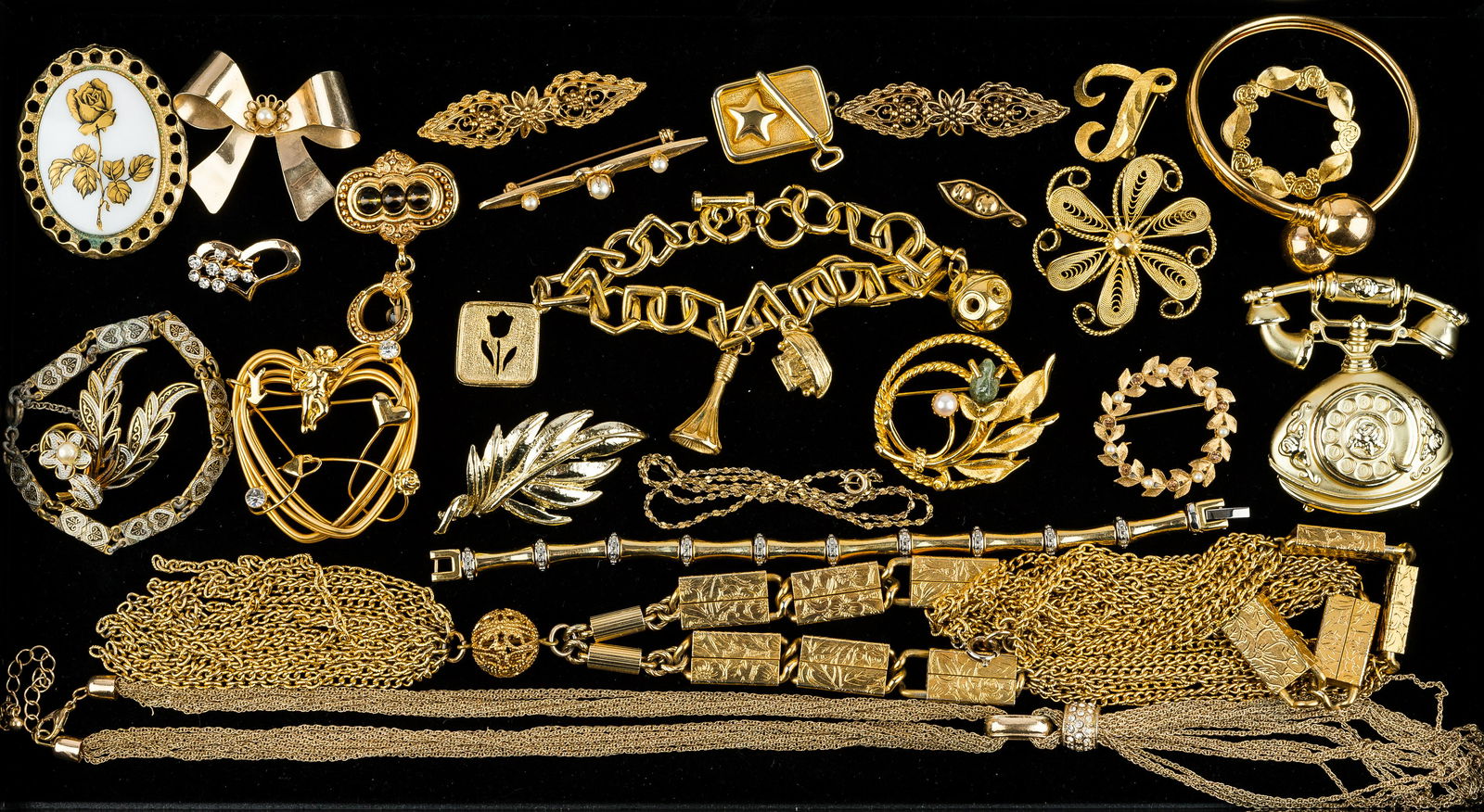 Gold Tone Costume Jewelry: 25 gold tone jewelry items including pins, bracelets, tassel necklaces, statement brooches, and more.
