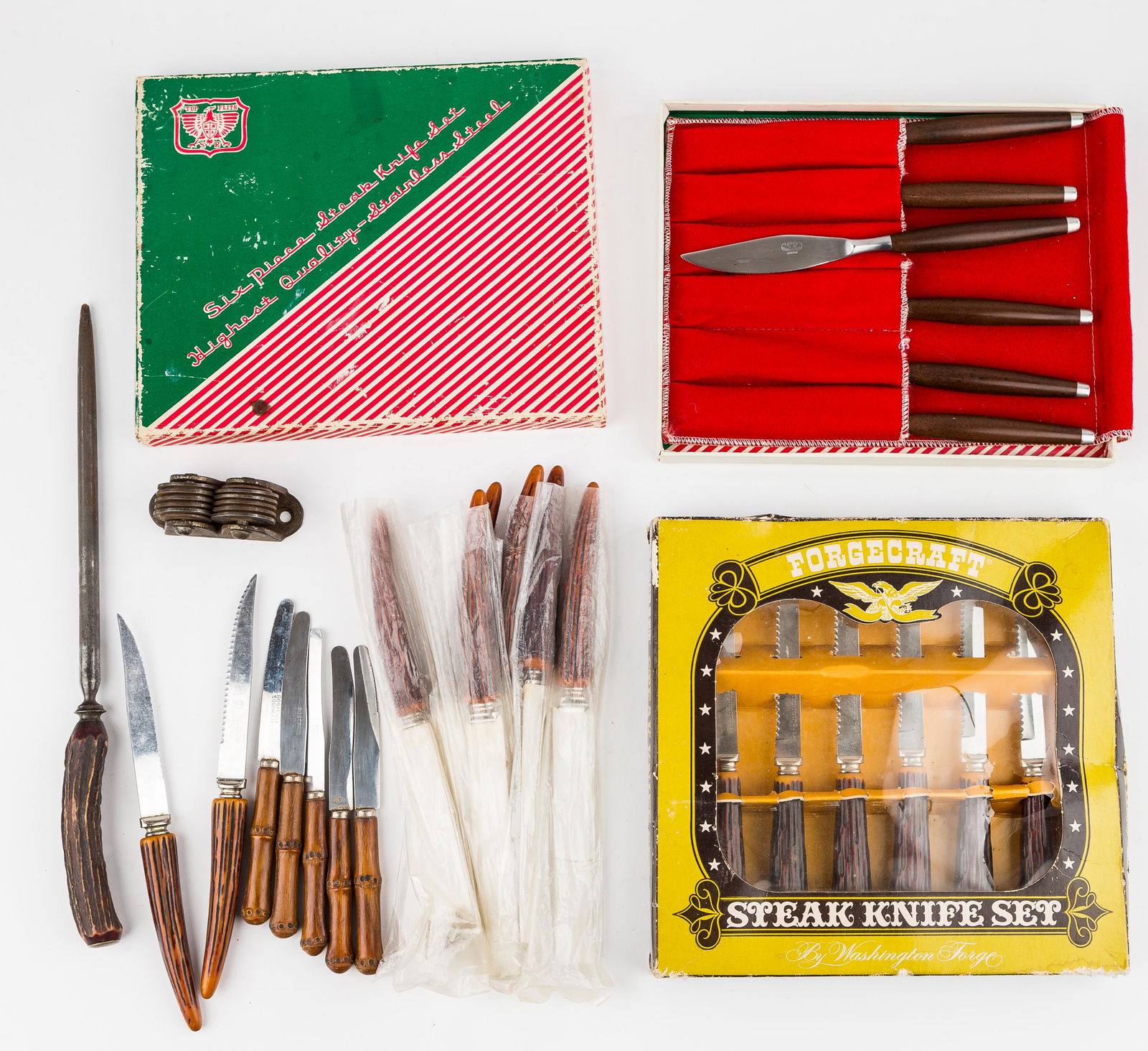 Vintage Steak Knives & Sharpeners: Top Flite stainless steel steak knife set with original box and 6 knives in fabric case NOS, 'Forgecraft' 6 knife steak set NOS, set of 5 bamboo handled German 'Rostfrei Solingen' knives, 2 'Sheffield