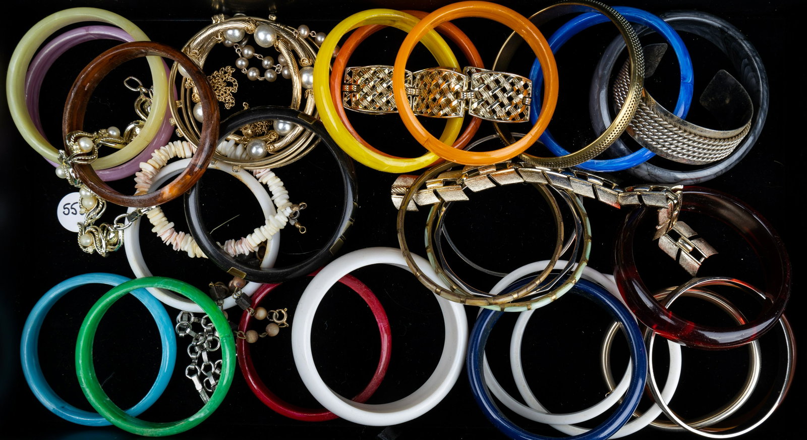 Vintage Bracelets: Over 30 various bracelets to include many cuffs, scarab style, gold and silver tone, glass and stone, butterfly, and more.
