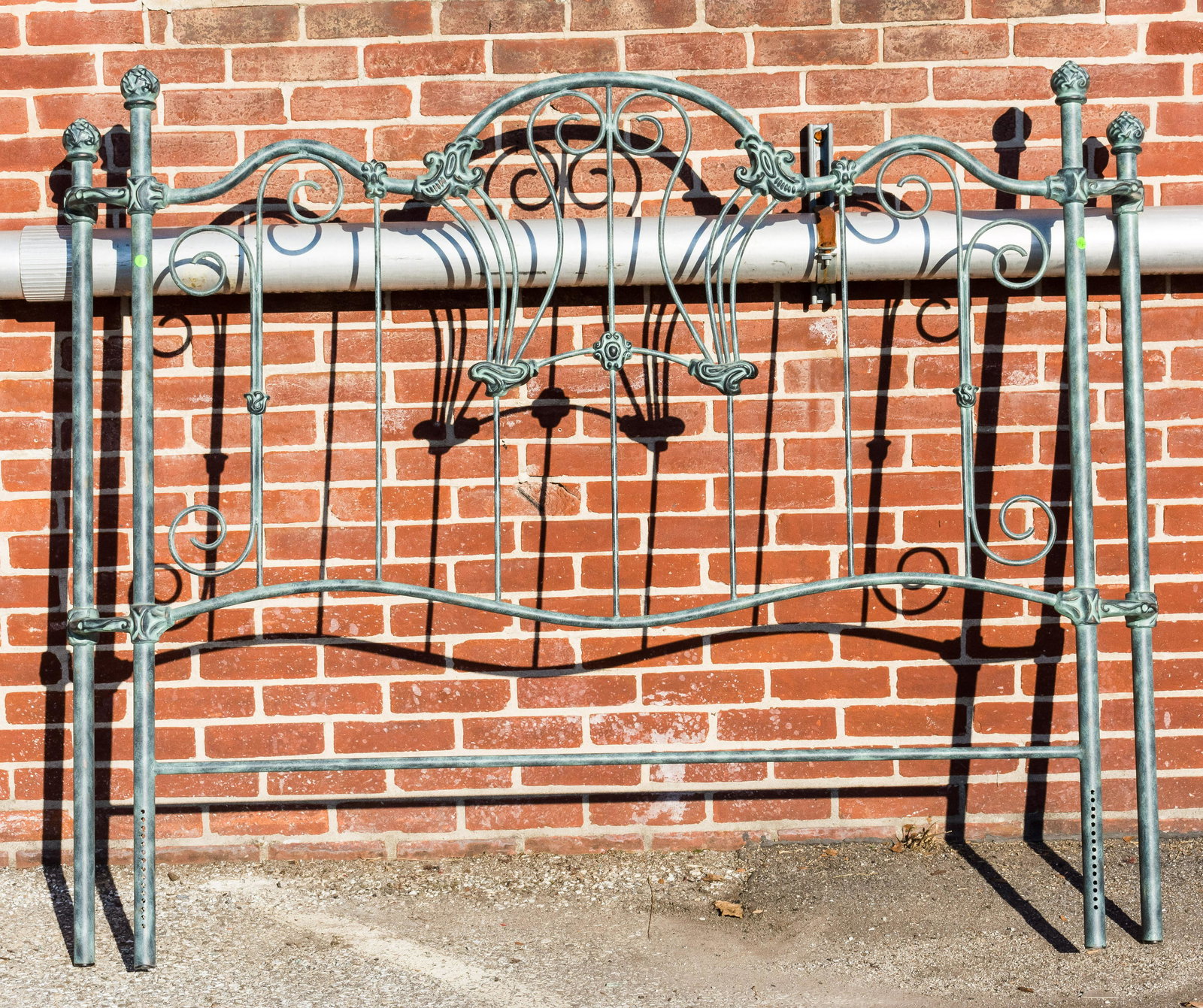 Metal Bed (Headboard Only): Size approx 60" H x 69" W x 7" D. Green, pineapple finials. As seen in photo. Pick up within 2 weeks of auction.