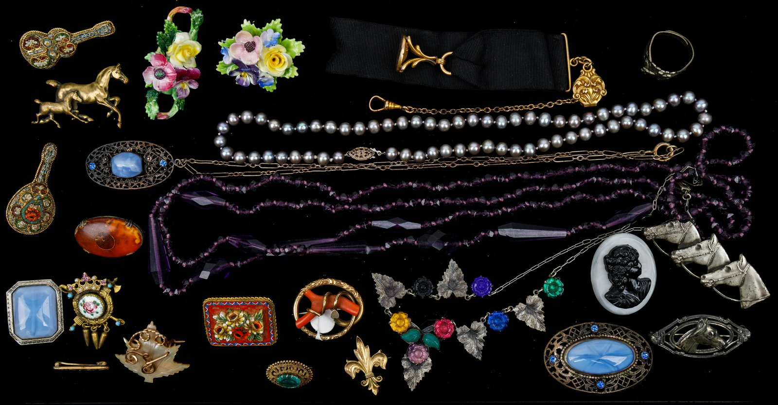Art Deco Estate Jewelry Collection: Long flapper era purple necklace, grey pearl silver clasp necklace, "Art Deco" flora and leaf glass necklace, sterling horse and other brooches, micro mosaic brooches, watch chain and more.