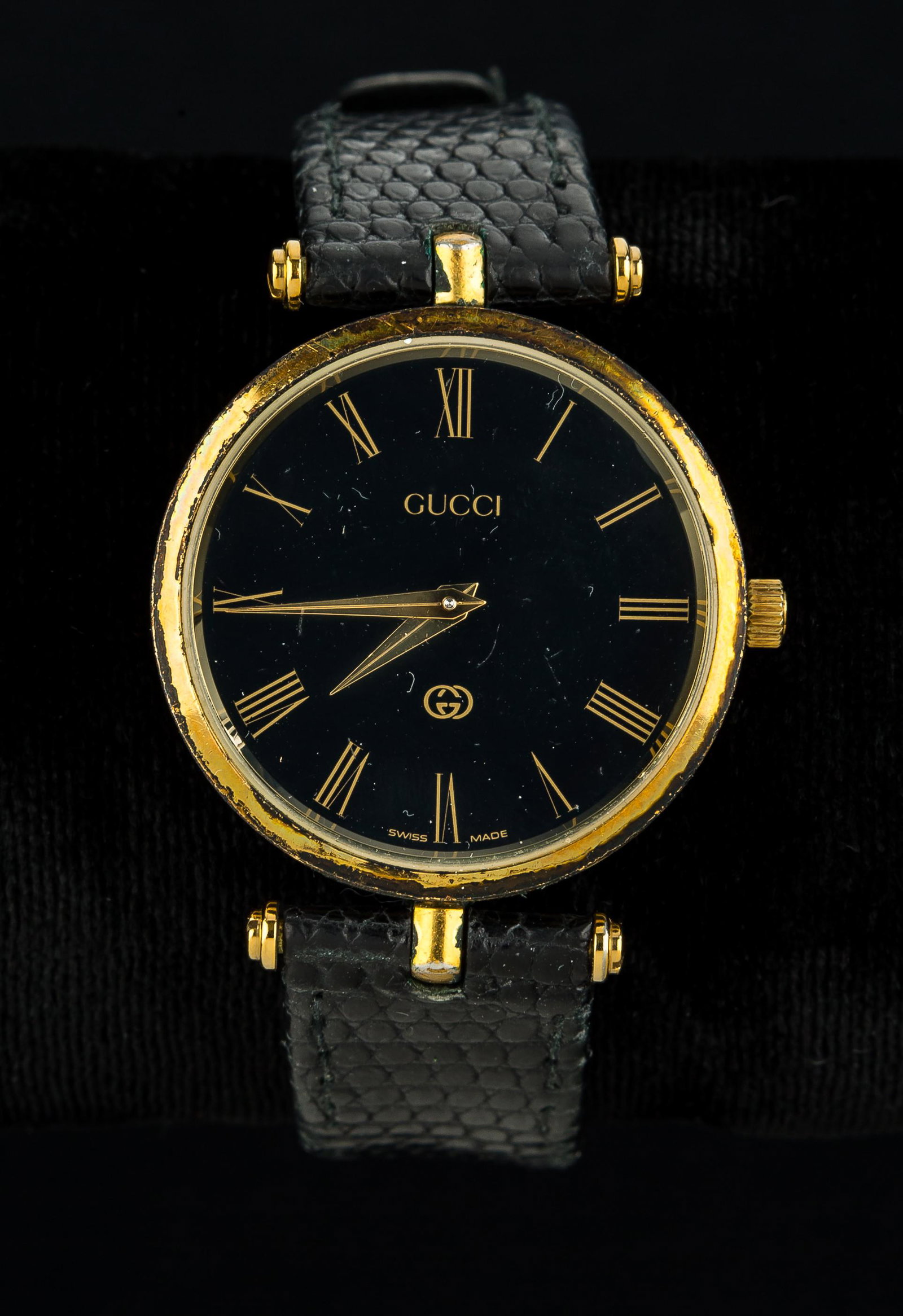 "Gucci" Designer Watch: "Gucci" signed watch with leather strap, circa 1980's - as found condition, some wear to strap.