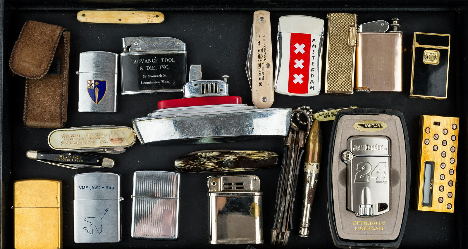 Lighters & Advertising Pocket Knives: Prince Rocko military lighter, un-monogrammed pinstriped Zippo lighter, Zenith, Jeff Gordon Nascar, Satolex calculator lighter, 'BG Leagueb' bullet lighter, Japanese boat lighter, and other lighters,