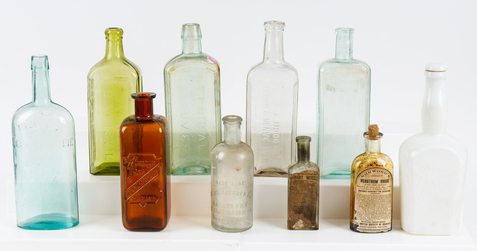 Antique Patent Medicines & Tonic Bottles: Haskin's 'Nervine' olive green bottle, Norwood's 'Veratrum Viride' with label, Dr. Kennedy's 'Medical Discovery', Armour & Co. 'Digestive Fermants' and milk glass bottle, brown bottle, Badger Fire Ext