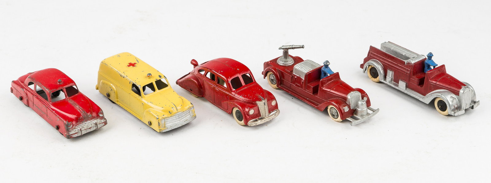 Vintage Tootsie Toy Emergency Vehicles: 5 Vintage Tootsie Toy vehicles including sprayer hose truck in excellent condition, fire truck in excellent condition, fire chief car in fair condition, ambulance in fair condition, and fir chief car