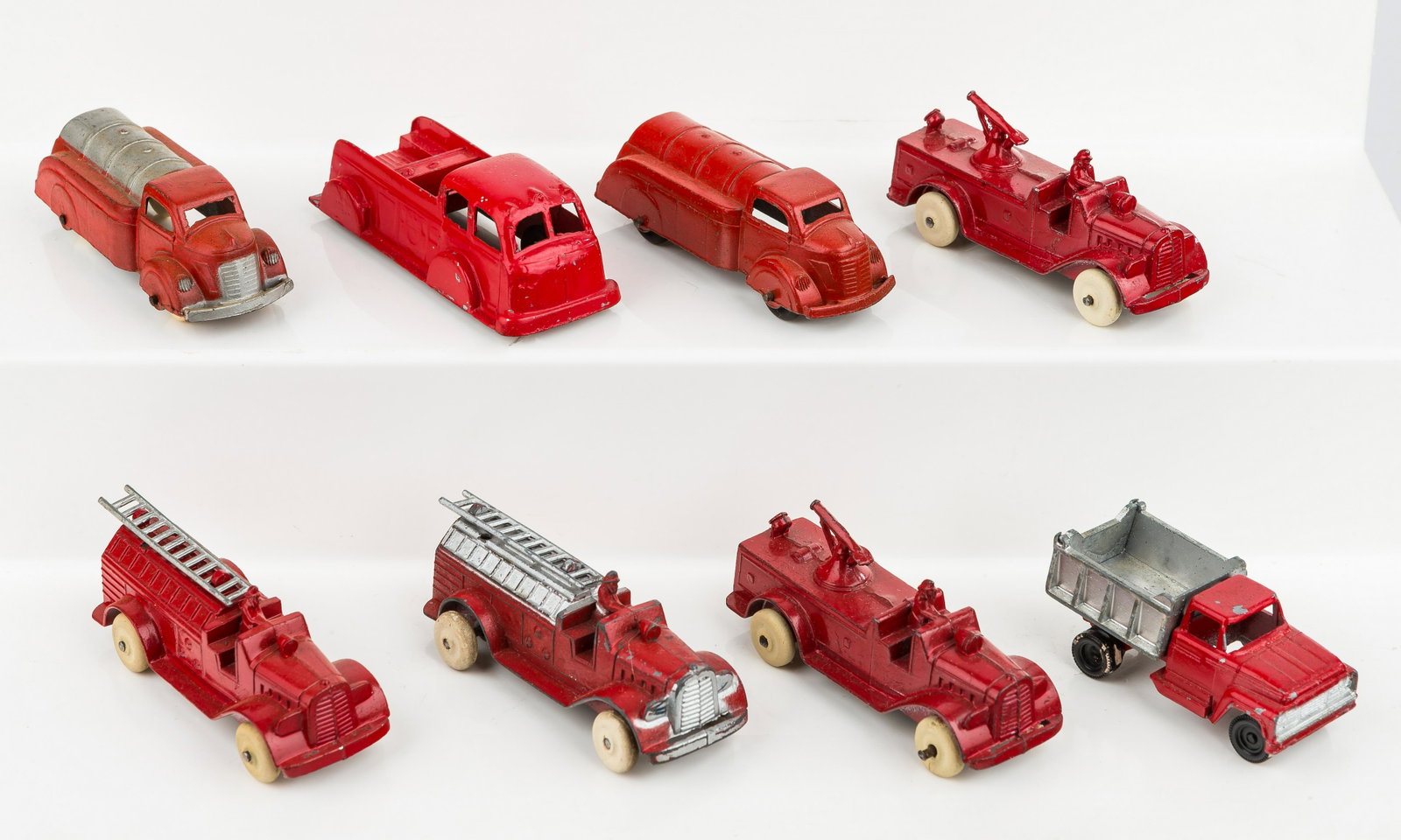 TootsieToy Fire Trucks (8): There are 8 TootsieToy firetrucks including 2 ladder trucks (1 excellent condition, 1 very good condition), 2 sprayer trucks (good), 1 utility truck (very good), 2 tankers (very good), 1 dump truck (g