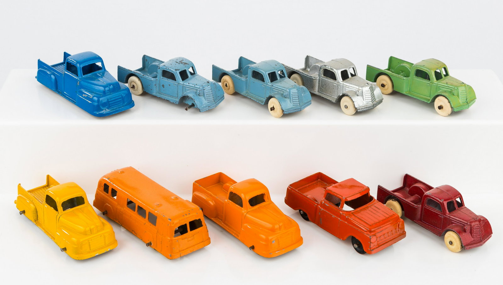Tootsie Toy Trucks (10): Tootsie Toy trucks include 9 pickup trucks, 3 in excellent condition, 5 in good condition, 1 in poor condition (missing tire), and 1 bus in very good condition. Quality and conditions as seen in photo