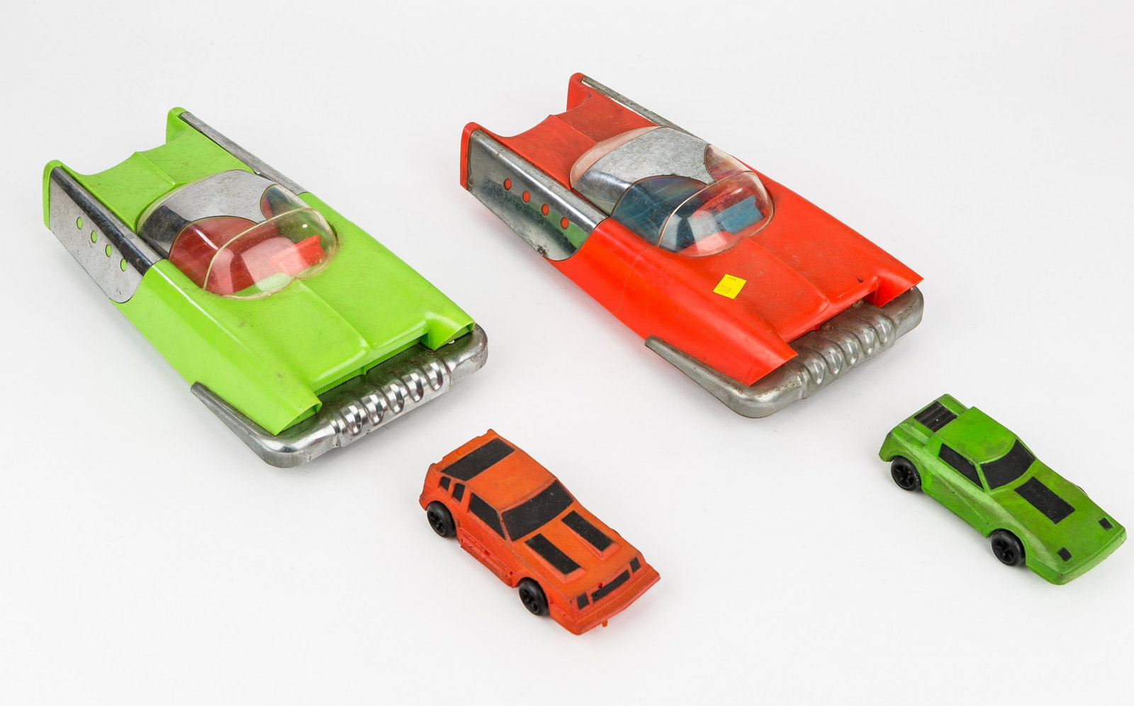 Parker Brothers Friction 'Dream' Cars, Mattel Cars: 2 Mattel friction plastic 'Dream' cars, both with aluminum side panels and front bumper, intact headlights, red car has blue interior with red steering wheel, missing rear light, green car with red in