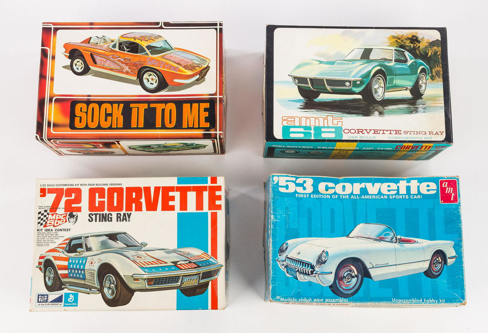 Vintage AMT Scale Model Corvettes (4): Vintage AMT scale model kits / Corvettes unbuilt in boxes include 72' Corvette Stingray 1/25 scale, box in very good condition, all parts intact, 53' Corvette 1/25 scale, box in fair condition, all pa