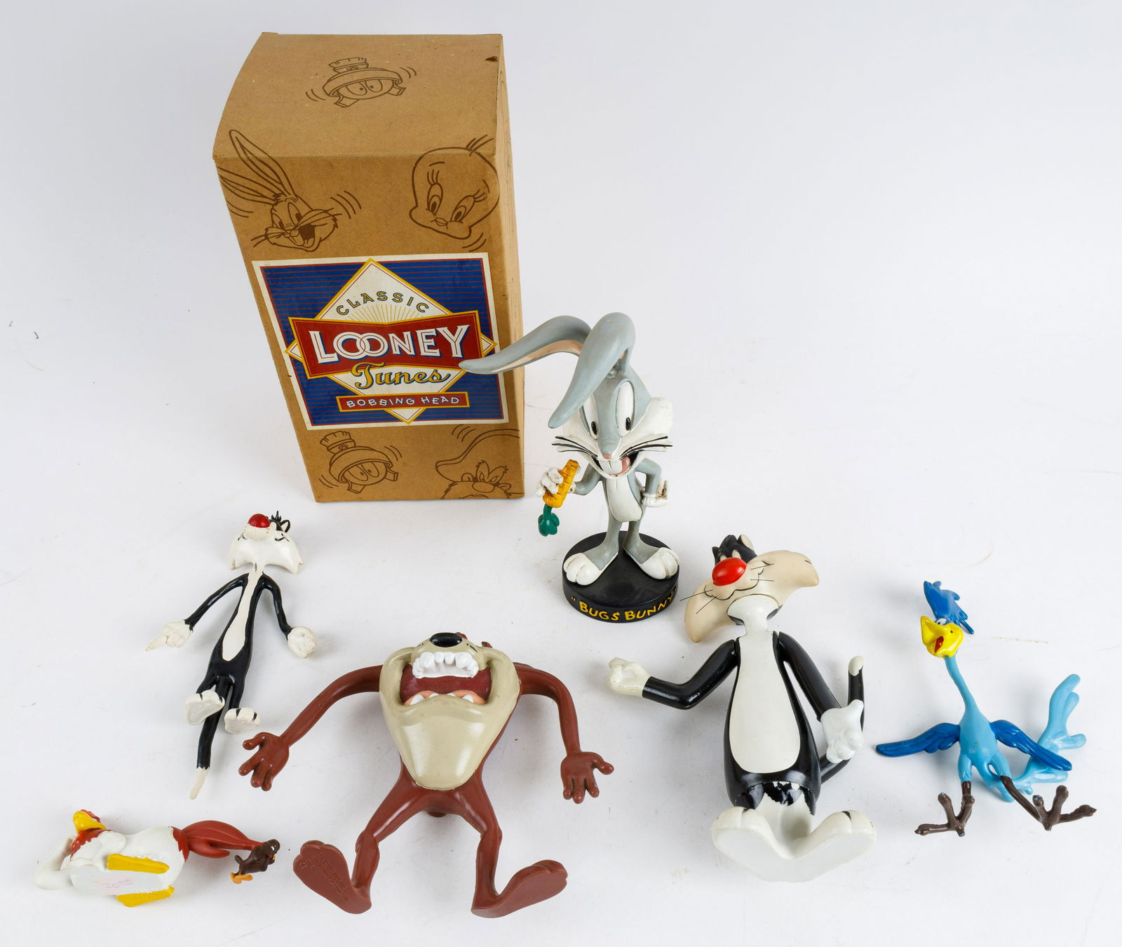 Vintage Looney Toons Toys: Vintage Looney Toons toys include Bugs Bunny bobble head in box (NOS), Sylvester plastic figurines large approx 8", small approx 6", Tasmanian Devil approx 6"H, Road Runner approx 6.5"H, and Foghorn L