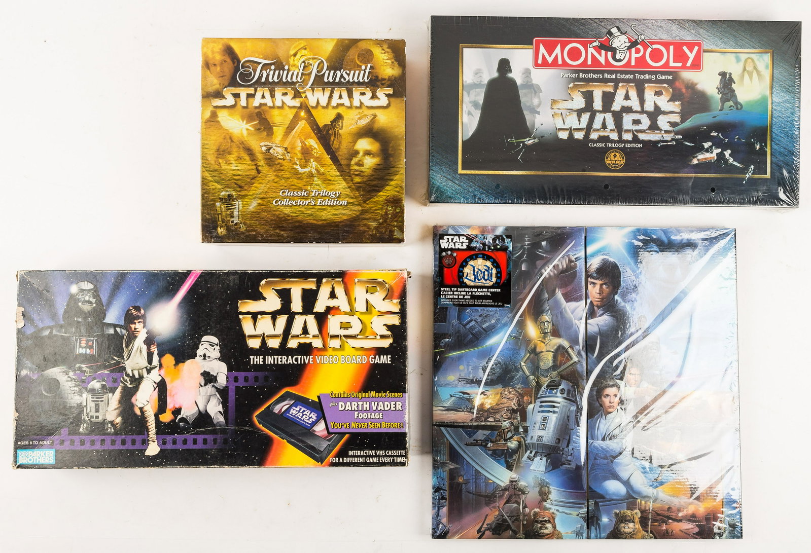 Vintage Star Wars Games (4): Jedi Dart Board NIP, Star Wars Monopoly Classic Trilogy Edition NIB, Star Wars Trivial Pursuit (opened box but looks complete), Parker Bros Star Wars Interactive Video Board Game item 40392.