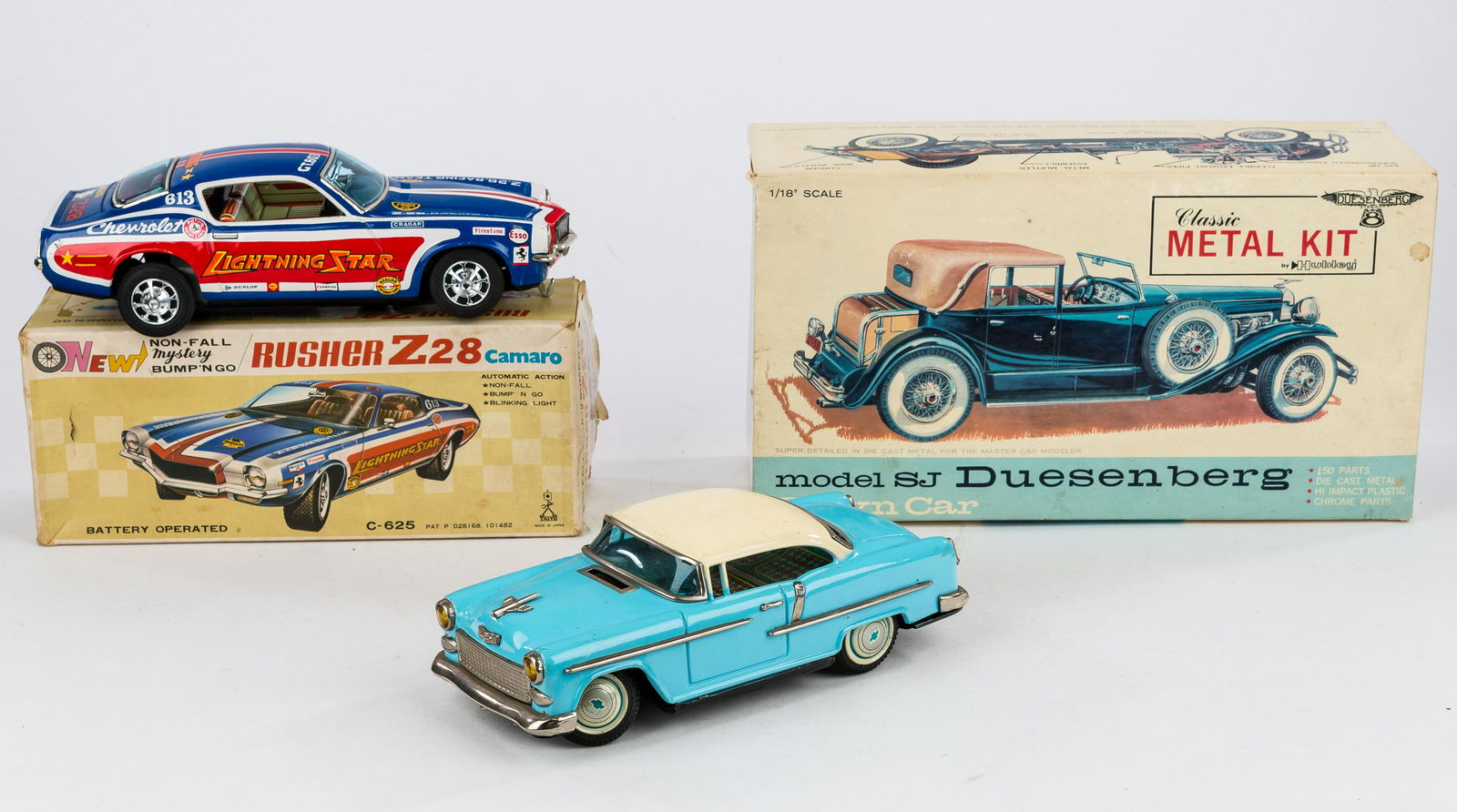 Vintage Toys & Hubley Metal Model Kit: Rusher Z-28 10" tin battery operated (untested) in good condition, Hubley metal model Dusenberg #4868-1000 (appears complete), and tin Chevy Belair approx 9"L Ichiko PU made in Japan battery powered c
