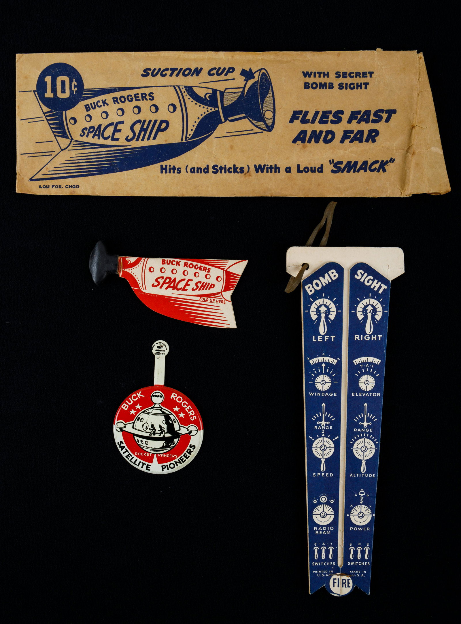 Buck Rogers Premium Shooter Game and Pin: Also Satellite Pioneers Rocket Rangers Buck Rogers lapel pin unbent, a Buck Rogers cardboard Morton's Salt Premium space ship shooter with original packaging and shooter made by "Lou Fox, Chgo". Morto