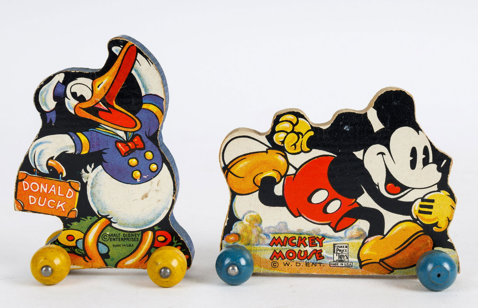 Mickey Mouse & Donald Duck Wood Block Pull Toys: Donald Duck wood block pull toy from 'Walt Disney Easter Parade' by Fisher-Price, approx 4"H, and Fisher-Price Mickey Mouse wood block pull toy approx 3.25"H.