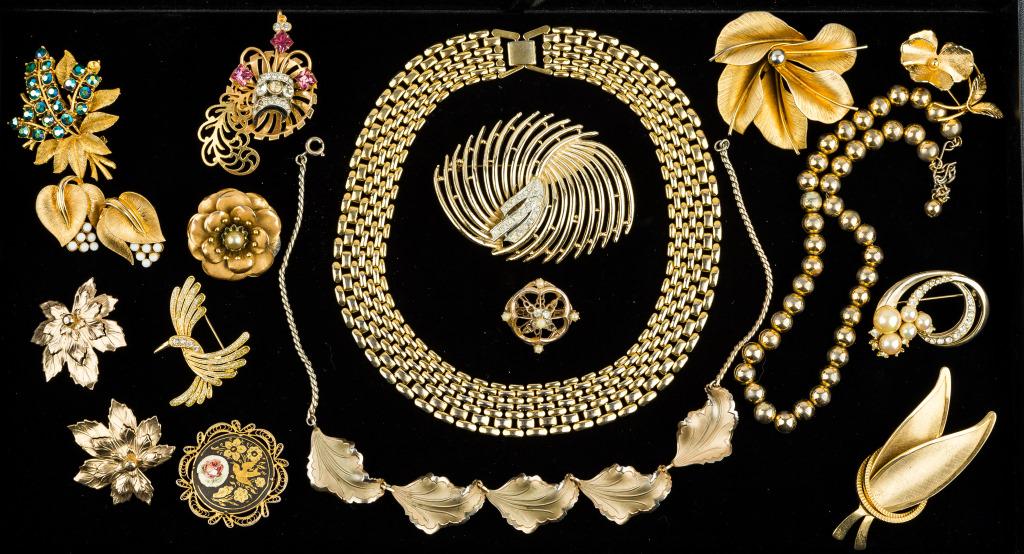 Vintage Gold Tone Jewelry: Collection of 21 gold tone vintage jewelry pieces including some Coro and Sarah Coventry, many unmarked.
