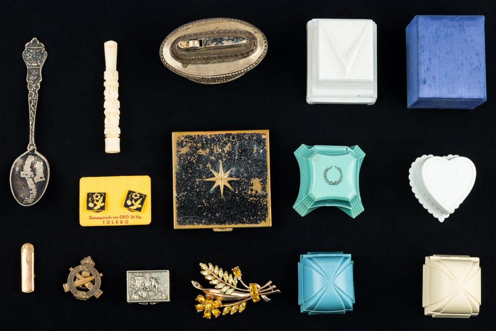 Vintage Box and Eclectic Jewelry Collection: Includes five various early celluloid jewelry boxes and a blue silk from Washington, DC, small Italy repousse box, rifle pin and rhinestone floral pin, "Ronson" Queen Anne lighter, carved elephant hol