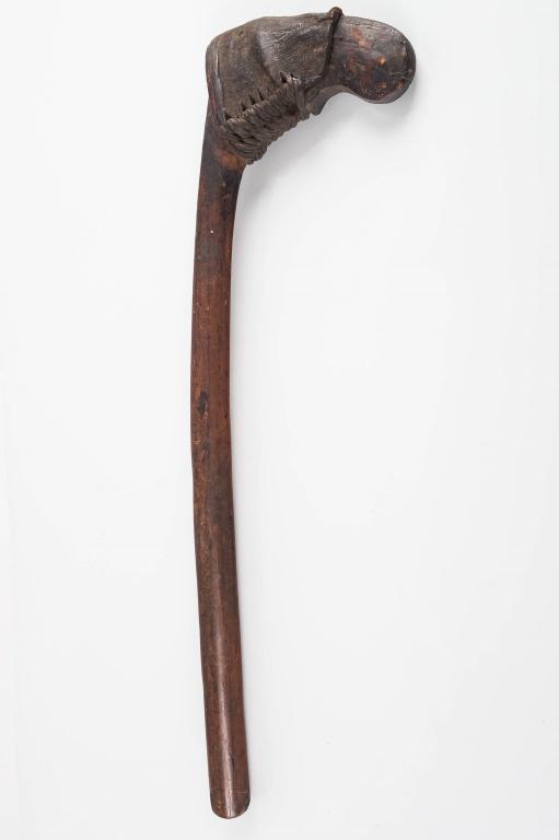 19th C Tribal War Club: Tribal war club "skull cracker" is African with a braided leather wrap, may have been a blade or other tool on other side of weapon head. Handle is dense hardwood. Head measures approx 6.5" W x 22.5" 