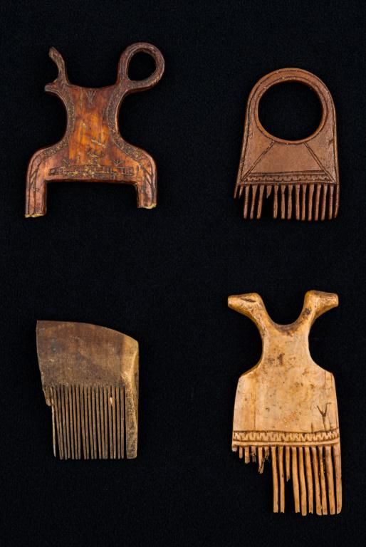 Inuit Eskimo Fossil Bone Combs: 4 Inuit Eskimo carved fossil bone combs, all with some ancient loss, 3 have decoration with 1 being especially decorated with human figures, largest approx 2.75"L, from Savoonga mainland Inupiak Thule