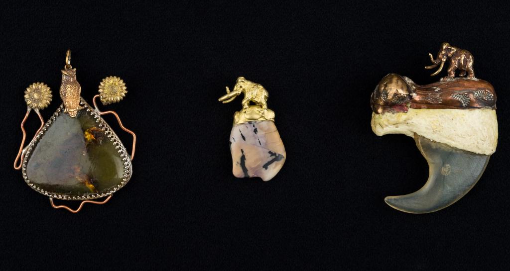 Alaskan Fossil Jewelry by Artist Miles Martin: 3 Pendants custom made and designed by Alaskan native artist Miles Martin, with his own metal castings, materials used are fossil mammoth, real amber with inclusions, and simulated bear claw, with mam