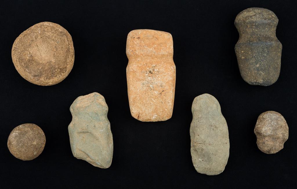 Pennsylvania Native American Axes & Artifacts: 7 Pennsylvania Native American stone axes and celts, largest approx 6"L. Special shipping considerations needed due to weight as items are very heavy.