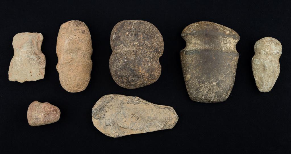 Pennsylvania Native American Axes & Artifacts: 7 Pennsylvania Native American stone axes including 1 exceptional large grooved axe from lower Susquehanna, and celts, largest approx 7"L. Special shipping considerations needed due to weight as items