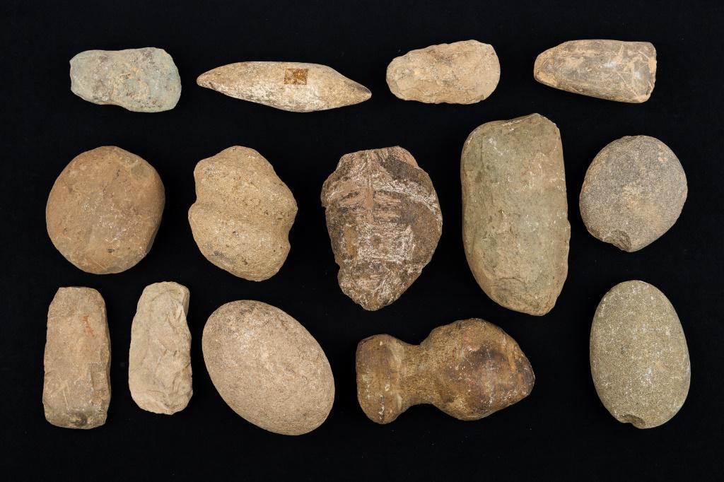 Pennsylvania Native American Artifacts: 14 Pennsylvania Native American artifacts including nutting stones, celts, axes and more.
