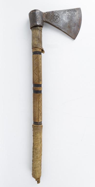 Native American Trade Tomahawk Early 20th C.: Antique tomahawk with carved wooden handle with rawhide accents, blade has maker's mark 'RG' with star and deer, approx 22.5"L x 6.5"W.