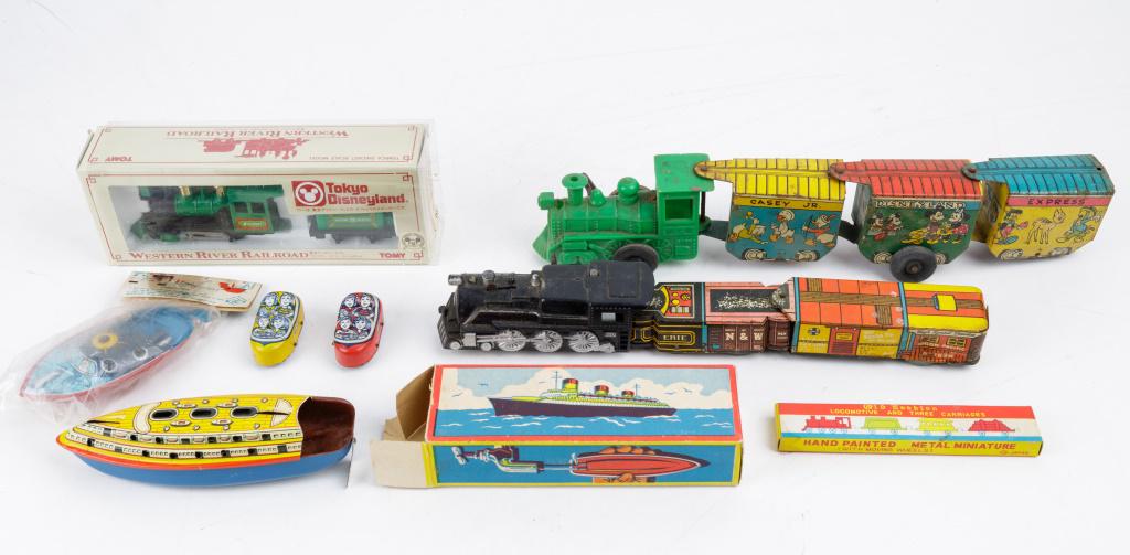 Tin Litho Trains, Boats, Coaster Cars & More: Trains includes tin litho Casey Jr. Disneyland Express (wind up not working), another tin litho with working wind up (missing a wheel), Tomy Western River Railroad from Tokyo Disneyland new in box, an