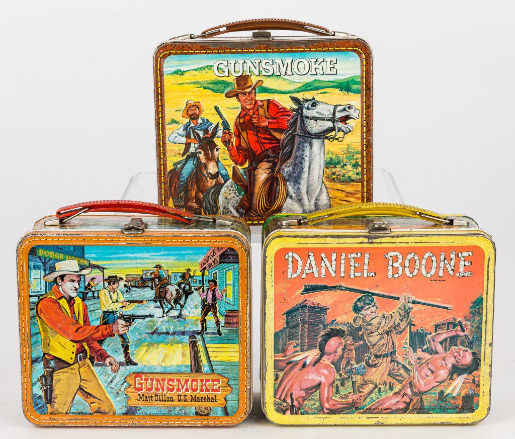Vintage Western TV Show Metal Lunch Boxes: 3 Vintage metal lunch boxes including Daniel Boone, Gunsmoke, and Gunsmoke Matt Dillon U.S. Marshal (with thermos), wear commensurate with age and use.
