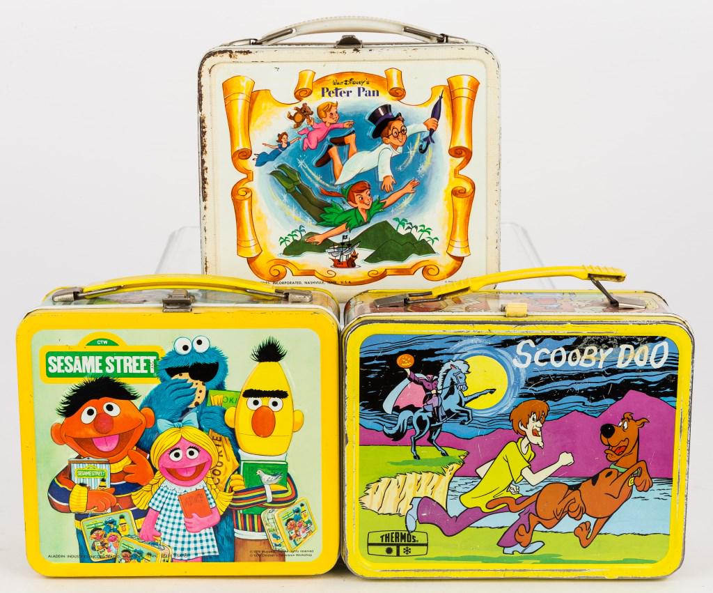 Vintage TV Show & Disney Metal Lunch Boxes: 3 Vintage metal lunch boxes including Scooby Doo (has thermos), Peter Pan, and Sesame Street (has thermos), wear commensurate with age and use.
