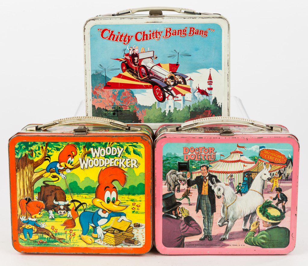 Vintage TV Show & Movie Metal Lunch Boxes: 3 Vintage metal lunch boxes including Woody Woodpecker, Doctor Doolittle, and Chitty Chitty Bang Bang (has thermos), wear commensurate with age and use.