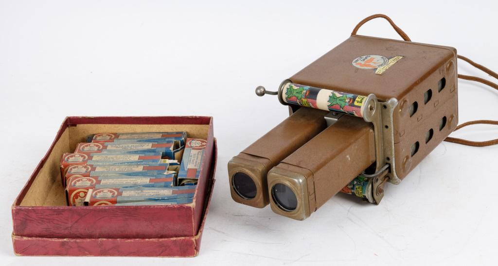 Uncle Sam Projector & Duracolor Films: Uncle Sam projector and 9 reels (8 with original boxes) including Dick Tracy, Fairyland Tales, Moon Mullins, Jackie Cooper and more.