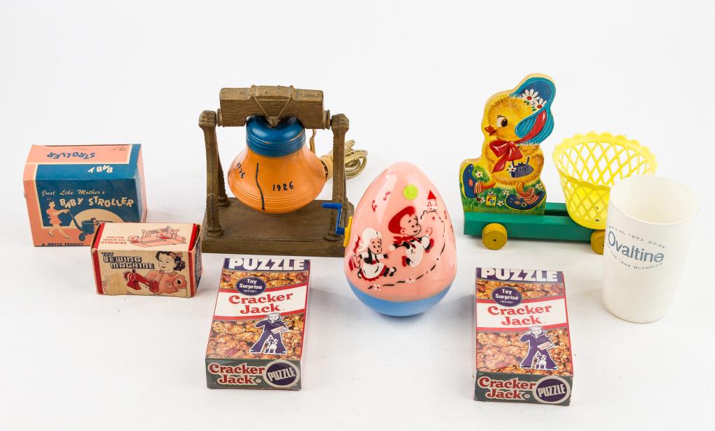 Vintage Toys, Cracker Jack, Ovaltine & Lighting: Plastic egg (does not work), 2 sealed Cracker Jack, Ovaltine cup, baby stroller toy in original box, sewing toy in original box, chick pull toy, and 150yr Centennial Liberty Bell light.
