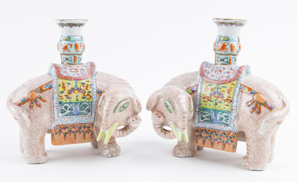 Chinese Porcelain Elephant Candleholders (Pair): Pair of Chinese elephant candlesticks with holder rising from saddle, approx 7.25"H x 7"L x 5"D, some paint loss commensurate with age and use, feet have surface wear.