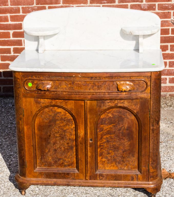 White Marble Top Wash Stand: Marble has been repaired and crack reglued. Should be cleaned up. Some veneer loss. Size approx 38" x 31.5" x 13". As seen in photo. Pick Up within 2 weeks of auction.