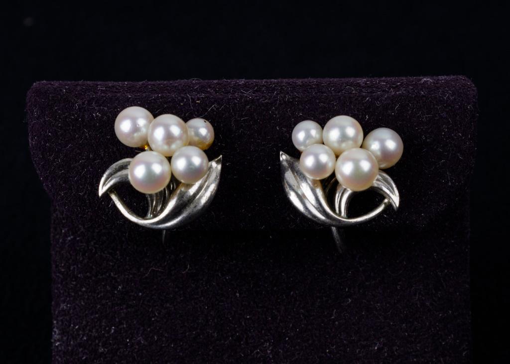Vintage Mikimoto Pearl Earrings: Fine "Mikimoto" .950 sterling 5 good luster pearls in each screwback earring with leaf detail.
