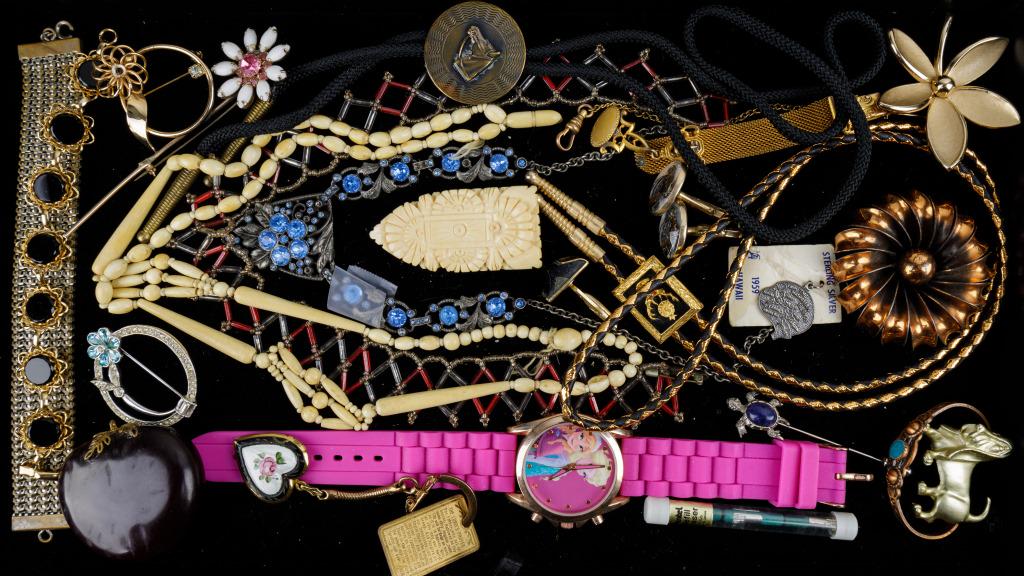 Vintage Estate Jewelry Collection: Sampling of large collection includes art-deco blue glass necklace (one stone missing) large carved Victorian clip, carved necklace, reverse painted horse cuff links, "Trifari" floral brooch, sterling