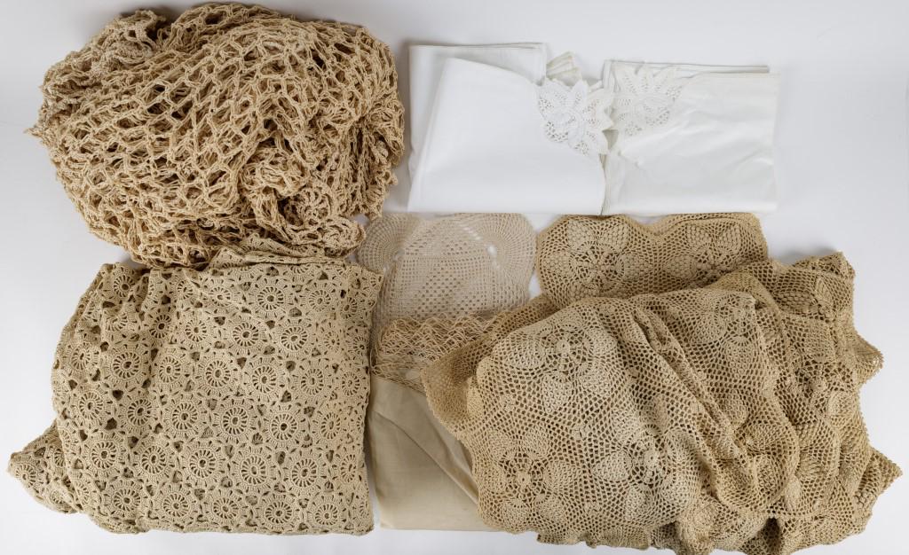 Vintage Lace Tablecloths, Napkins & Doilies: 3 Lace and net tablecloths (approx 7' x 6'), 5 white napkins and 3 doilies, and a set of over 10 linen napkins. Some discoloration due to age and wear.