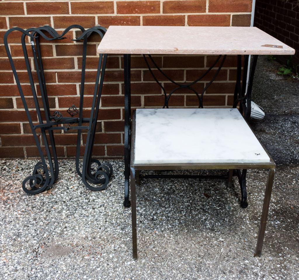 Brass and Cast Iron Marble Top Tables, Plant Stand: White marble top on vintage cast iron sewing base, small brass frame table with white marble top, and 2 foldable black plant stands. Sewing base with top is approx 29" H, 28" W, 20" D. The smaller bra