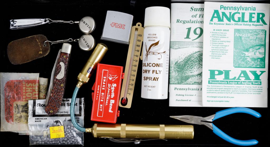 Fly Fishing Tackle & Accessories: Frontier brand pocket knife, Flex-Lite adjustable flashlight, Orvis brand retractable fob pins, South Bend snake bite kit, FMC Zippo brand measuring tape, and more.
