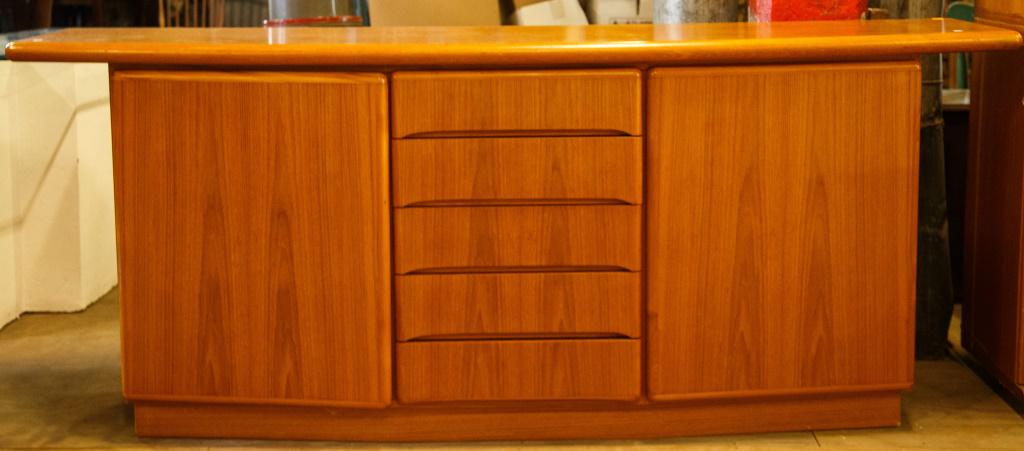 Danish Modern Teak Finish Sideboard by Skovby: It has item number 1012 with solid teak top and elements of base have a teak finish. There are some surface scratches but in overall good condition. It measures 32" high x 79" wide x 19" deep.