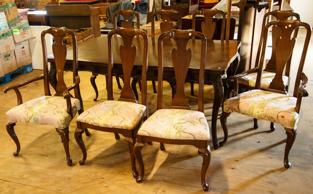 John Widdiicomb Table, 8 John Stuart Chairs: Two are arm chairs, all pieces with a walnut finish, and table measures 29 1/2" high x 45" wide x 72" long (extends with three 17" leaves to approx. 123" long). Table has some veneer loss at center.