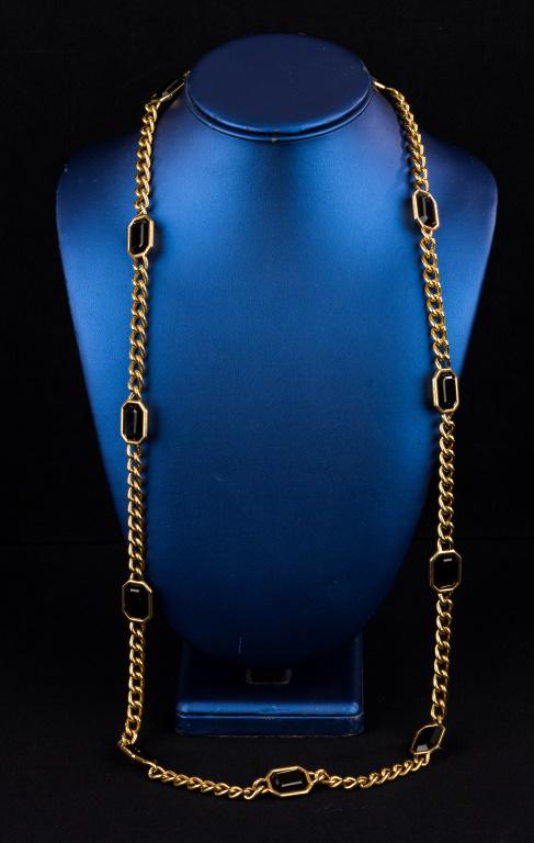 Designer Yves St. Laurent Necklace: Vintage designer YSL long figaro gold tone chain necklace with ten octagon black stones with YSL signed in square on necklace.