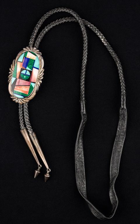 "Frank Yellowhorse" Navajo Native American Bolo: "Frank Yellowhorse" substantial sterling silver stylelized oval bolo with malachite, various turquoise and lapis masterful inlay large sterling silver tipped leather cords. Mark of Frank Yellowhorse,
