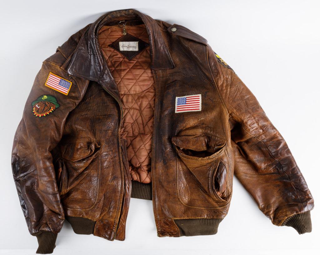 Marine Corp Leather Bomber Jacket: Adam Spencer brand Marine Corp leather bomber jacket with various patches, size 46, pockets have ripped lining, main zipper pull detached but included.